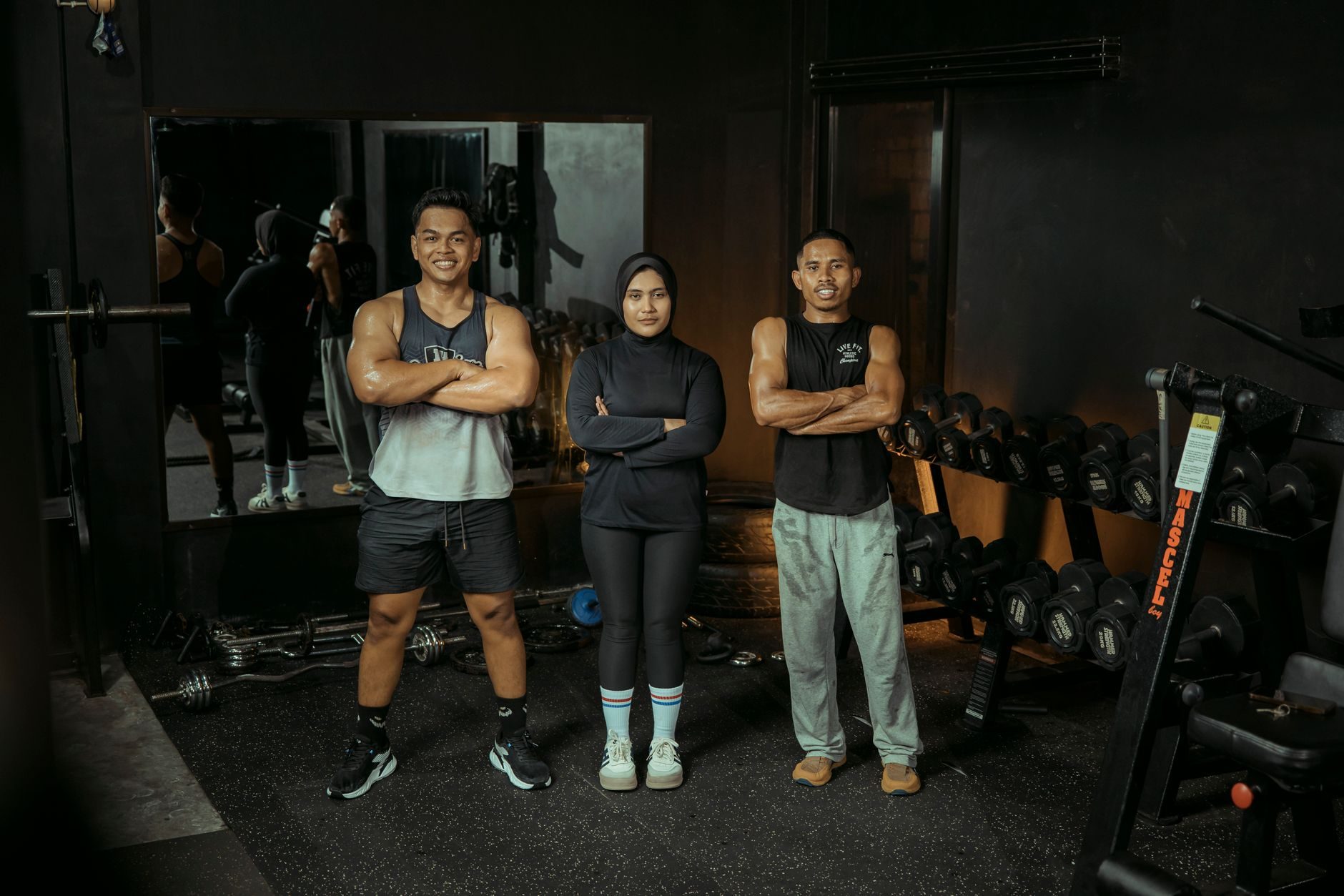 Personal trainers standing in a gym